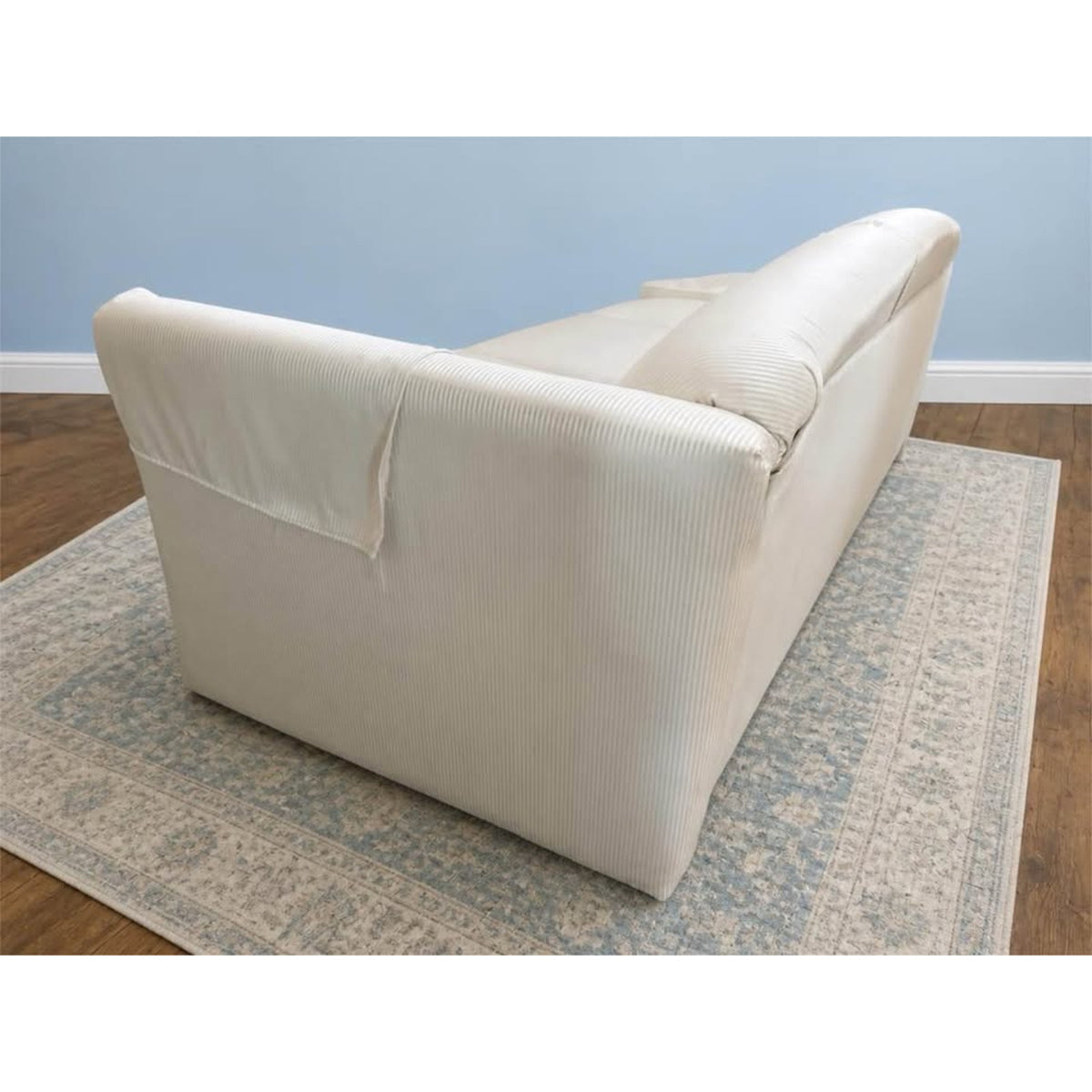 White & cream colored striped 3 seater couch