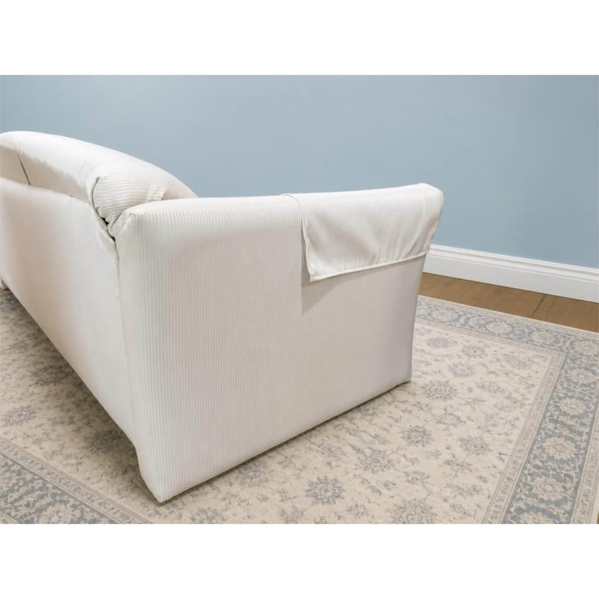 White & cream colored striped 3 seater couch
