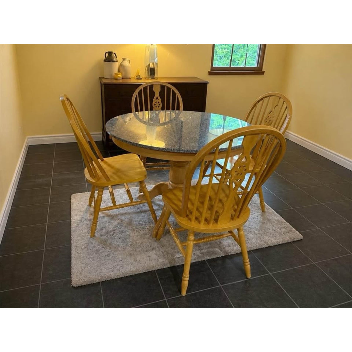 Round pedestal style granite top dining room table black/grey granite and 4 matching chairs