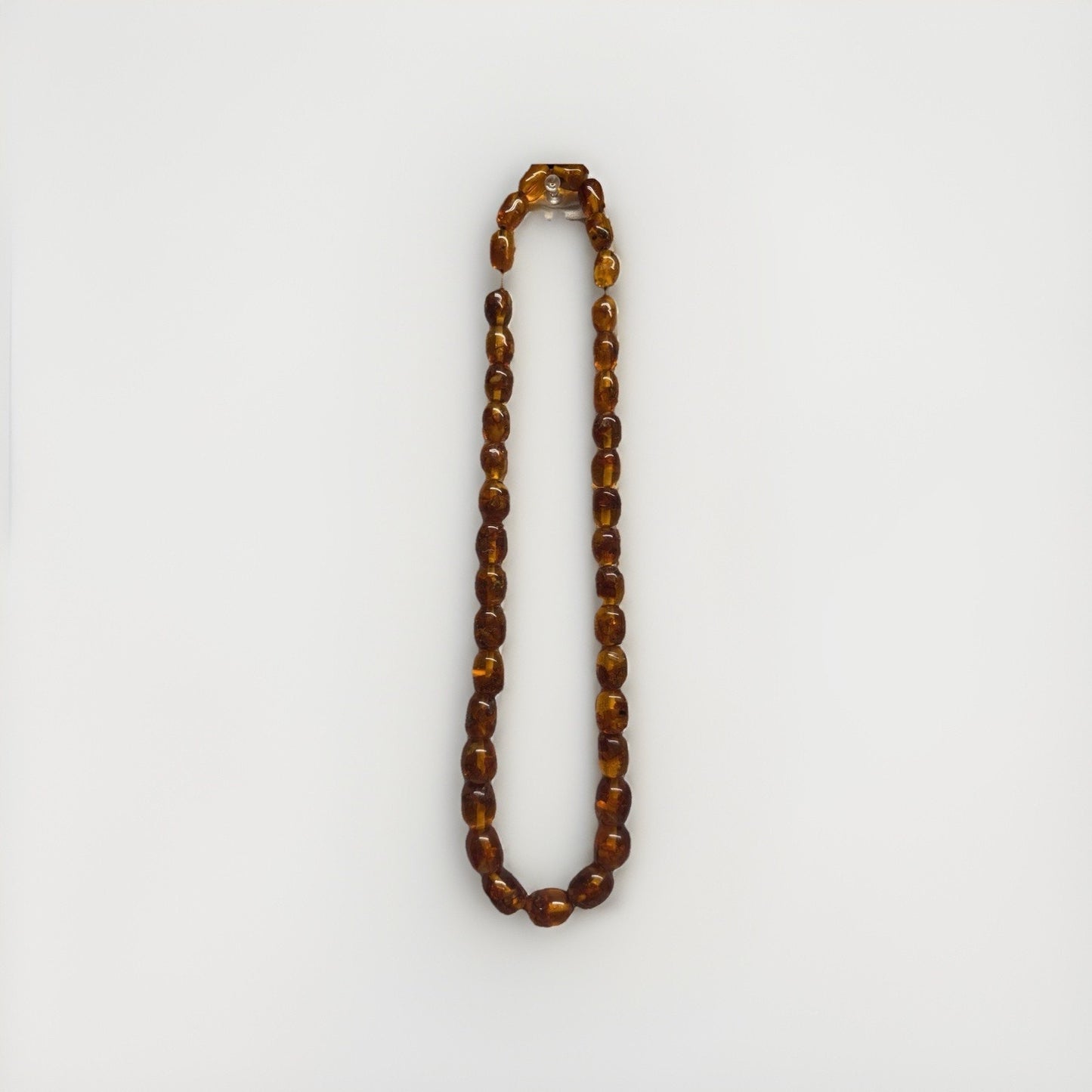 Vintage Baltic amber barrel bead necklace no clasp, pull over head approx. 13”
