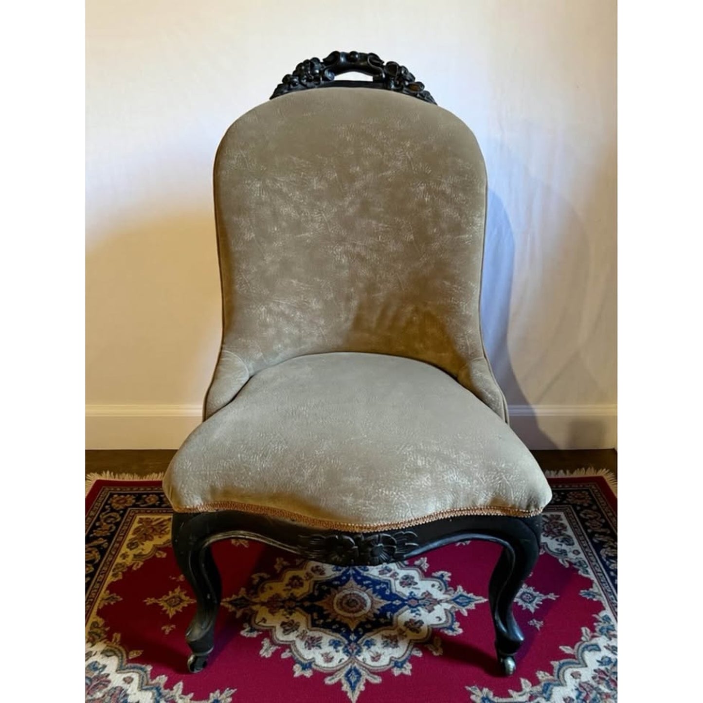 Antique 19th century Victorian chair with carved wood & original casters newly re- upholstered