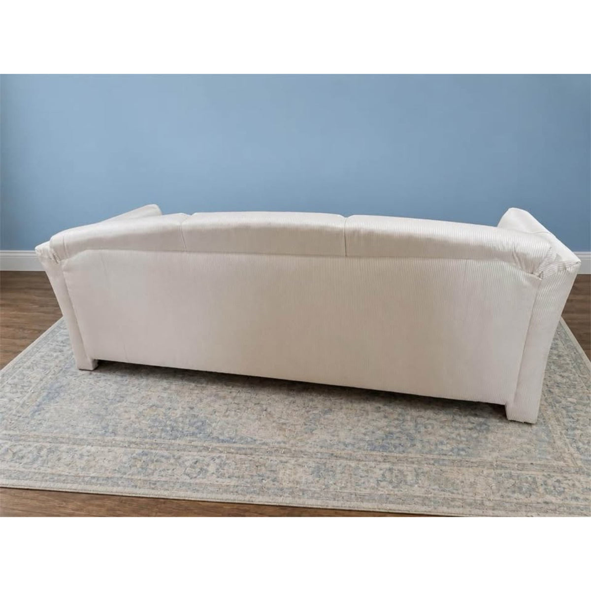 White & cream colored striped 3 seater couch