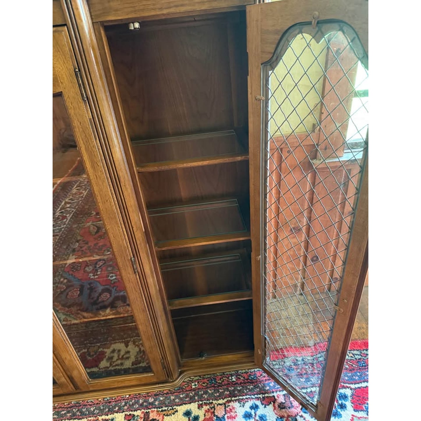 Antique wooden hutch/china cabinet/liquor cabinet with glass doors & shelves, iron detail
